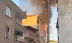Evde çıkan yangında önce çocuğunu, sonra kendisini 3'üncü kattan attı; o anlar kamerada