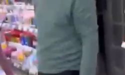 Kırtasiyede genç kızın fotoğrafını çeken şüpheliye tepki