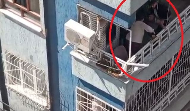 Balkondan düşme tehlikesi geçiren Down sendromlu çocuğu, komşusu kurtardı; o anlar kamerada